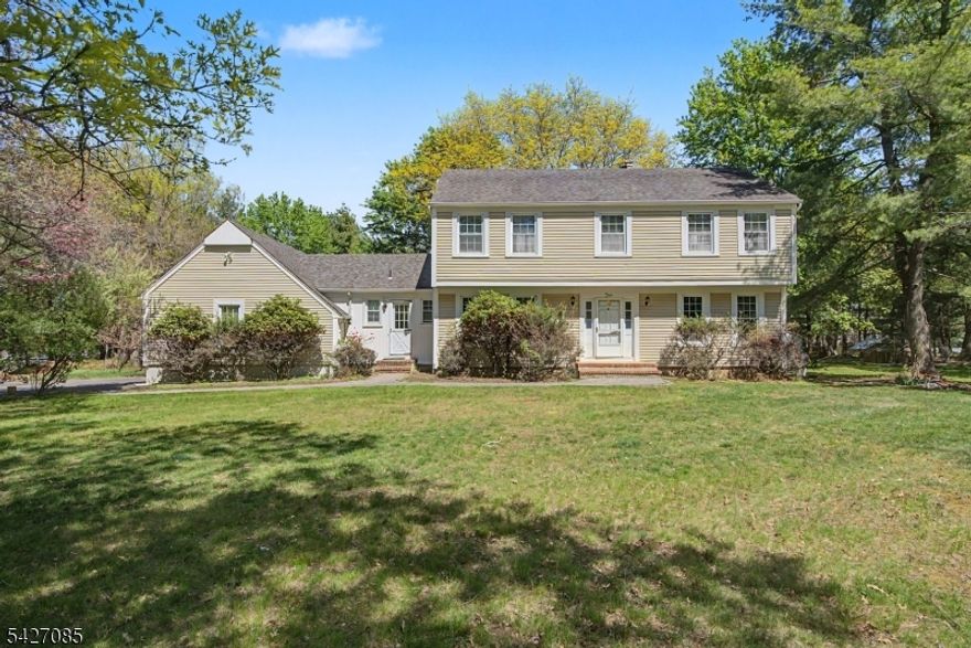 Set on a generous 1.93-acre level lot in a quiet Readington neighborhood, this classic four-bedroom, two-and-a-half-bath colonial offers space, comfort, and timeless appeal. Hardwood floors run throughout the home, adding warmth and character to every room. The main living areas are designed for both everyday living and entertaining, featuring two wood-burning fireplaces one in the inviting living room and another in the cozy family room. The family room also includes sliding doors that open to a deck, creating an easy flow to the outdoors and a perfect setting for relaxing or hosting gatherings. Upstairs, you'll find four well-proportioned bedrooms, including a spacious primary suite, along with two full baths. A convenient half bath is located on the main level as well as the laundry room which has direct access to the spacious 2 car attached garage. With its expansive property, peaceful surroundings, and close proximity to local schools, shopping, and everyday conveniences, this home offers the ideal blend of privacy and accessibility.