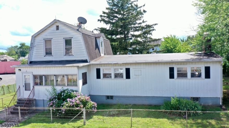 No Further Showings Per Sellers....This is a unique 2 family property w a 2 bedroom first floor apartment and a studio apartment on the second floor on a large lot containg a heated  1,400 sf 4 car garage w an 8 car driveway..The garage is a great opportunity for a car collector haveing a commercial workshop for personal use only..the home has hot water baseboard and a newer furnace..