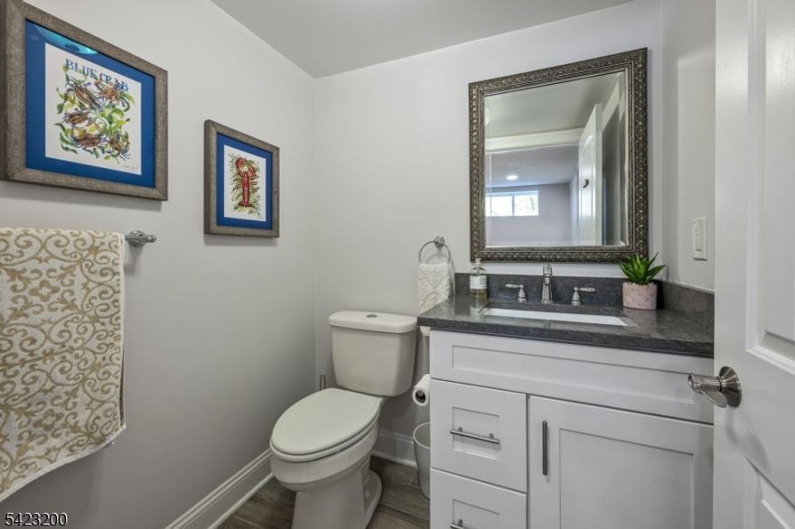 Beautifully fully renovated home set on a manicured, level lot with exceptional indoor-outdoor living, moments from downtown Basking Ridge and Oak St School. This home offers both comfort and convenience in a sought after neighborhood.  The open-concept main level features a stunning kitchen with oversized center island, high-end appliances, quartz counter tops, custom cabinetry and seamless flow into the dining area with sliding doors to an exceptional patio-perfect for everyday living and entertaining. A sun-filled living room with expansive windows fills the space with natural light, creating a warm and inviting setting. The main level also offers three bedrooms, including an en-suite, plus an additional full bath.  Upstairs, a beautiful primary suite features two walk-in closets and a stunning bath with soaking tub and separate shower.  A spectacular office space completes the upper level-ideal for todays lifestyle.  The finished lower level is exceptionally spacious, offering incredible flexibility for recreation, media, or work-from-home needs, along with a half bath and abundant storage.  Additional highlights include built-in speakers in the office, primary bedroom, kitchen, living room, basement, and patio area. Step outside to a professionally landscaped yard with a patio and expansive lawn-perfect for gatherings or quiet enjoyment.  Move-in ready and thoughtful updates throughout-this home truly has so much to offer.