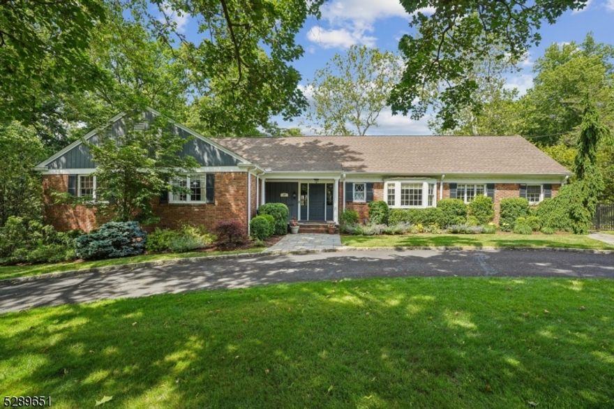 Just in time for Summer, Welcome to your entertainer's dream house.  Move right in to this updated, expansive ranch featuring a primary suite plus 2 bedrooms on the main level, with 2 additional bedrooms upstairs - perfect for extended guests, This home offers ample space for everyone. The eat-in white kitchen boasts granite countertops, stainless steel appliances, electric wall oven plus gas oven/stovetop, and a center island ideal for gathering. The massive finished lower level offers plenty of storage space and closets, and walks out into one of the oversized garage spaces.  Entertain in style with a custom built-in bar area that looks out to a stunning backyard, featuring mature landscaping, an inviting in-ground heated pool, BBQ with gas hook-up, and plenty of deck and patio space perfect for dining alfresco or just relaxing. Updates and renovations made throughout the years. Situated on approx .50 acres, this brick home also features 4 car garage, circular driveway, and tremendous curb appeal.  Must see in person to be fully appreciated.  Close proximity to the highly ranked Deerfield elementary school.