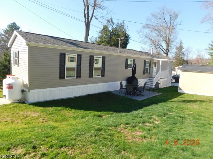 Wow! Large 2 year old manufactured home in move in condition. Original owner in this non-smoker home situated in Highlander Hills Estates.Home features 2" x 6" exterior walls , thermopane windows , vinyl siding,concrete driveway with all appliances. Great modern floor plan with each bedroom and bath at opposite ends of the home.Primary bedroom has walk-in closet.Leased land 55+ community. New 8 x 10 shed and patio.Leased land financing available to qualified buyers.