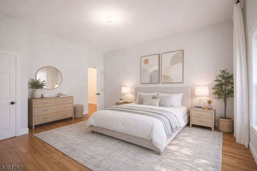 Dazzling spacious three bedroom and two full bath FIRST floor unit with high-end finishes, central air and washer/dryer hookup. One PARKING spot included. Exclusive access to the back deck makes together time perfect under the stars. Hardwood floors throughout. High ceilings offer more volume. Primary bedroom has en suite bathroom that will amaze and a room that could be used as a spectacular walk-in closet or even an extra room for guests. Kitchen is equipped with ample quartz counter tops, a breakfast bar and a coffee alcove. Recessed lighting adds even more crispness to the space. Located near transportation and close to downtown. OWNERS WELCOME PUBLIC HOUSING PROGRAMS. Ready for immediate move-in.