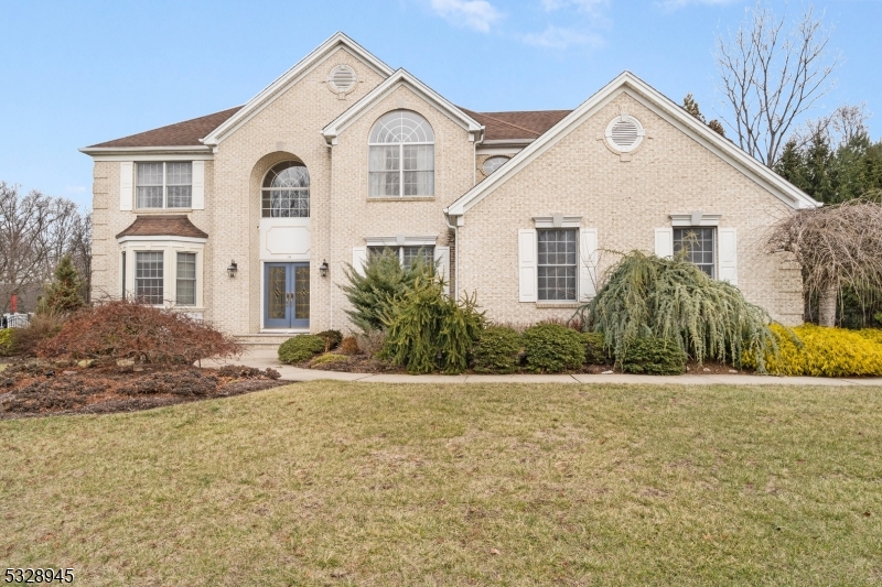 Outstanding brick Colonial set back beautifully in a welcoming sidewalk neighborhood- 10 rooms including 4 airy bedrooms, 3 full baths, powder room, towering lighfilled entryway with soaring 18' ceiling and french doors opening to a handsome library with a gorgeous built-in floor-to-ceiling bookcase, tasteful open floor plan living & dining room areas replete w rich custom millwork, fantastic sunken family room boasts a pass-through gas fireplace, radiant wall of stacked windows w tranquil views, & coffered volume ceiling, delightful den/home office shares the pass-through fireplace, exceptional designer kitchen faces the family room & features quality appliances including a Bertazzoni stainless steel gas range & a Sub Zero panel refrigerator/freezer, gleaming quartz countertops, abundant custom cabinetry w undermount lighting, center island w galley seating, & adjoining eat-in dining area w sliding door to the Trex deck & pool area, spacious laundry/mudroom has charming coat hooks & handy garage access. Second floor has hardwood flooring throughout and primary bedroom boasts 12' volume ceilings. gas fireplace, 2 walk in closets and spectacular bath. This 3,922 sq ft beauty has an additional 1,400 sq ft finished basement w theater, game & exercise rooms & full bath. 3 car garage w electric charger, Trex deck w outdoor TV & gas line to grill, paver patio/ fire pit plus salt-water pool with waterfall & spa: fenced -in yard plus whole house generator & block to middle school.