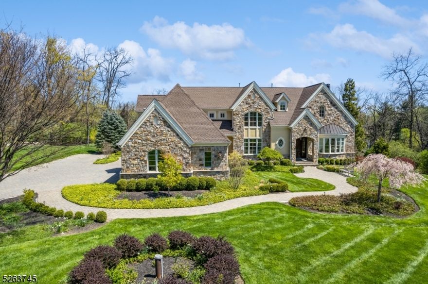 Discover a blend of luxury and tranquility in this exquisite custom-built home, nestled on 3 acres of serene countryside. Featuring a striking facade of fieldstone and stucco, this property is a masterpiece of design and craftsmanship. Marvel at the expansive interiors, 10-foot ceilings that enhance the sense of grandeur and space. The home's architectural elegance is evident in its barrel arch doorways and a rounded two-story foyer that welcomes you into a world of refined beauty. The heart of this home is its gourmet kitchen, designed with top-of-the-line appliances, ample counter space, custom cherry cabinetry, granite counters, and recessed lighting. Adjacent to the kitchen, the open floor plan seamlessly connects the living, dining, and outdoor spaces, making it perfect for entertaining and everyday living. Large windows throughout the home flood the interior with natural light and offer uninterrupted views of the surrounding countryside, ensuring peace and privacy. Completing this exceptional residence is a finished basement designed for relaxation and entertainment, featuring ample space for a home theater, gym, or game room. Additional highlights include energy-efficient systems, a three-car garage, and meticulously landscaped grounds that invite outdoor living and enjoyment. Experience the perfect blend of country living with modern conveniences in this remarkable home, where every day feels like a retreat.