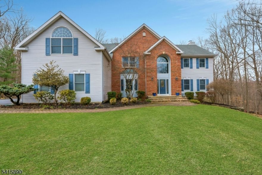 This beautifully maintained home, proudly offered by its original owners & thoughtfully updated throughout. A sun-drenched foyer sets the tone as you enter, leading into a stunning, updated kitchen featuring stainless steel oven, a 5-burner stove, a warming drawer, expansive countertops, a butler's pantry, & a walk-in pantry. This kitchen is truly a chef's dream. The open-concept family room is warm & inviting, centered around a cozy fireplace perfect for gathering. The formal dining room is equally impressive, featuring stunning mahogany floors that add richness & elegance to the space. The first floor includes a desirable ensuite bedroom ideal for long-term guests. Upstairs, the luxurious primary suite offers soaring ceilings, a private office, & a beautifully updated bathroom complete with a skylight, creating a serene retreat. All bedrooms are generously sized, offering comfort and flexibility. The walkout basement is a true extension of the home, showcasing rich wood paneling, a wall of windows, & generous space for entertaining, a gym, and additional storage. Set on a quiet cul-de-sac in a highly sought-after neighborhood, just moments from the center of Warren & Rte 22, this home offers both privacy & convenience. Enjoy scenic, tree-lined views from every window, an oversized composite deck with a gas line for grilling, & a secluded hot tub on the patio just steps from the walkout basement. A 3-car garage completes this exceptional offering. Don't miss it!