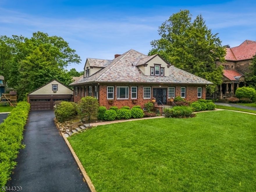 Step into a property that's truly in a class of its own. This all-brick, stand-alone classic blends craftsmanship with undeniable character. From its hand-laid brick exterior to its central living room layout, this distinctive property offers five bedrooms and five bathrooms, arranged within a flexible floor plan. Additional highlights include a spacious second-floor great room, two fireplaces, radiant heat bath/floors, hardwood floors throughout and charming period details. The expansive basement/lower level features an original wet bar, a recreation room, and several versatile spaces suitable for a variety of uses. Modern updates include central air conditioning,  a brand-new heating system, security & fire alarm system and updated windows throughout the home. The property also features a two-car garage with a full loft. The ultra-private backyard offers a dedicated sports court and ample space to design your own custom outdoor retreat. Easy location in a charming, historic, gas lamp-lit town just a few blocks from direct train service to NYC and top-rated schools.