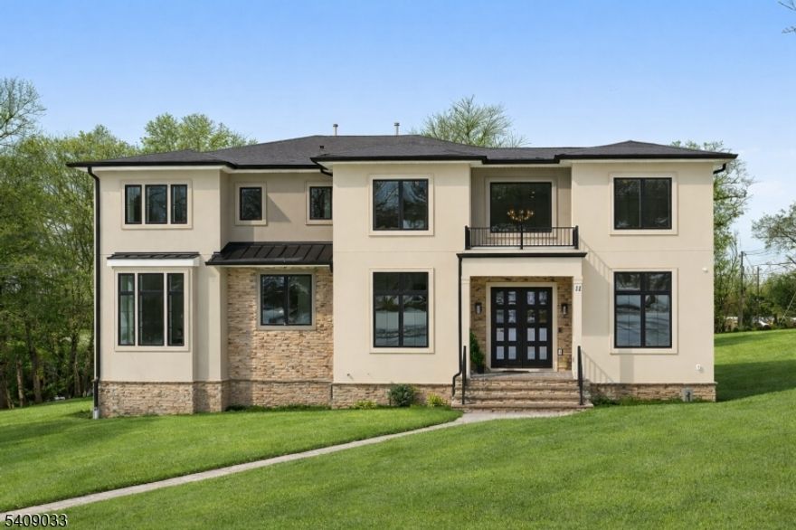 Modern Masterpiece with Timeless Curb Appeal. This exceptional NEW CONSTRUCTION Center Hall Colonial blends modern sophistication with classic architectural design in Livingstons prestigious Riker Hill section. Set on a flat 0.58-acre lot, this 6,500+ sq ft residence makes a striking first impression with its elegant stucco and stone facade. A grand two-story foyer with marble flooring introduces sun-filled interiors defined by clean lines, custom millwork, and refined finishes. The main level features formal living and dining rooms, a private office, custom mudroom, and a first-floor guest en-suite. The designer kitchen impresses with a waterfall quartz island, quartz backsplash, custom cabinetry, premium stainless steel appliances, walk-in pantry, and butler's pantry with wine cooler, flowing seamlessly into the dining area. The dramatic double-height family room with fireplace and built-in speakers opens to an expansive deck for effortless indoor-outdoor living. Upstairs, the primary suite offers two custom walk-in closets and a spa-like bath with soaking tub, dual vanities, and glass shower. Three additional en-suite bedrooms and laundry complete the level. The finished walk-out basement includes a recreation room, bar, fitness room, guest en-suite, and built-in speakers. A three-car EV-ready garage and a 10-year builder's warranty complete this feature-rich offering.