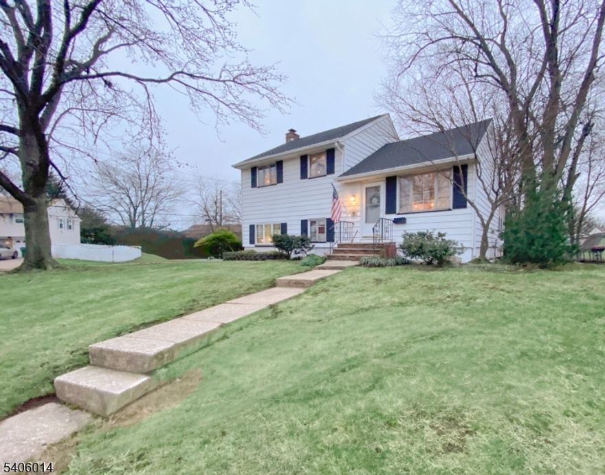 Spacious expanded 4-bedroom split-level home situated on a large corner lot. This open-concept residence features an eat-in kitchen and a generously sized dining room filled with natural light.  Wood floors enhance the main living areas and bedrooms, while the large family room offers a cozy gas fireplace perfect for gatherings and relaxing evenings.Additional highlights include a dedicated laundry room, enclosed porch/mud room for additional storage or to suit your personal needs, and an expanded garage complete with a workshop, ideal for hobbies or extra storage. With solid bones and ample space, this home is ready for your personal updates and finishing touches the possibilities are endless.Ideally located near Vineyard Park and conveniently close to shopping, restaurants, entertainment complexes, and major roadways, offering both comfort and accessibility.