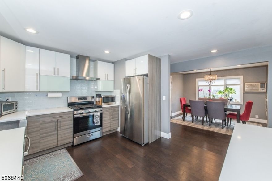 First floor apartment! Amazing location! This modern and bright first floor unit features OPEN FLOOR PLAN, updated kitchen w SS appliances, 2 bedrooms, formal dining room, 1 and a half baths, laundry hook-ups, deck, storage.