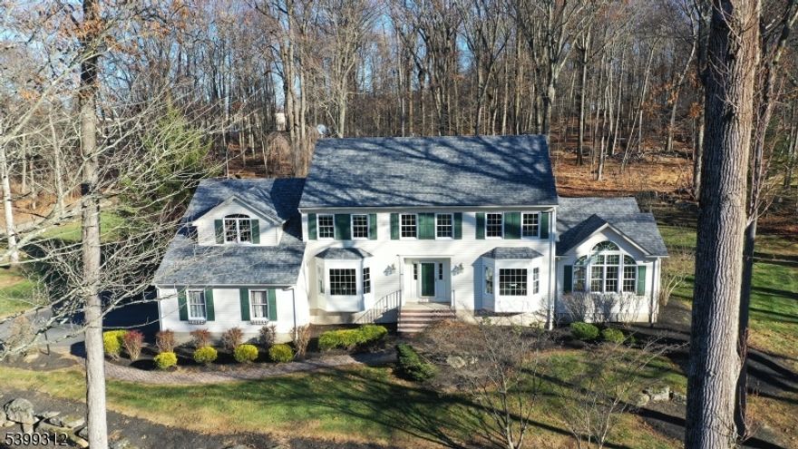 This classic 4 bedroom, 3.2 bath Chester Colonial offers timeless charm with exceptional space and style, perfectly set on a quiet cul-de-sac close to schools and downtown. Brimming with curb appeal, the home welcomes you with a desirable floor plan and many special features including beautiful hardwood floors, skylights, freshly painted rooms, custom built-ins, and high ceilings accented by large moldings. The kitchen is equipped with granite counters, a center island with seating, a coffee bar, generous breakfast area and sliders leading to a spacious and newly updated composite deck with a step-down to inviting paver patio ideal for effortless indoor-outdoor entertaining. A radiant and spectacularly updated sunroom with a wet bar provides a relaxed gathering spot, while the private office decorated in aviation style offers inspiring views for work-from-home days. A first-floor full bath makes one floor living a real possibility. A convenient back staircase leads to an impressive loft storage above the garage and an oversized bonus room, giving the home wonderful flexibility. The finished basement extends the living space even further with billiards and recreation rooms, a beautiful bar area, and a half bath perfect for game nights or guest quarters. Outside, the well-maintained backyard offers plenty of room for play and relaxation. With abundant storage throughout and thoughtful details at every turn, this beautifully kept home blends classic appeal with modern comfort.