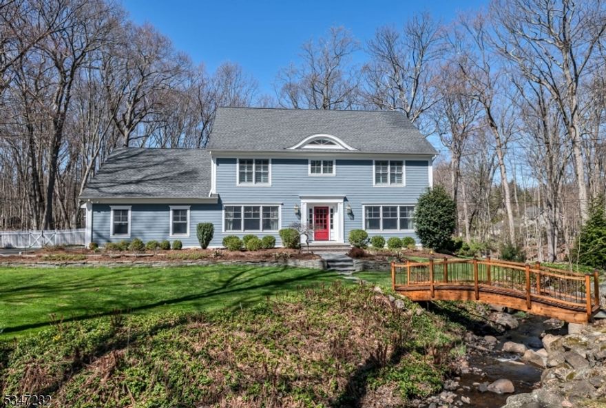 One-of-a-kind center hall colonial set on nearly 1.3 acres of breathtaking park-like property in one of Allendale's most desirable neighborhoods. A beautiful entryway welcomes you to a seamless layout, including a sunlit living room, formal dining room and a gourmet eat-in kitchen with French doors to an expansive covered terrace. The inviting family room features a wood-burning fireplace and the nearby den or playroom leads you to a convenient mudroom and attached garage. Upstairs you'll find 4 bedrooms including a luxurious primary suite with a sitting area, gas fireplace, ensuite bath and private office. The finished lower level boasts a newly-built custom 1,300-bottle wine room, TV room and game room. The thoughtfully designed backyard is perfect for entertaining with an in-ground pool, hot tub, and tranquil views of the babbling brook from every angle. Ideal location to top-rated schools, shops, transportation & more.
