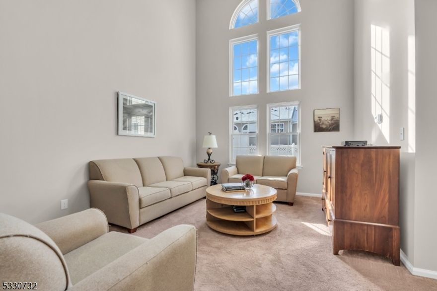 OPTIMIZED VALUE!!  Step into this beautifully updated, sun-filled, and spacious two-level townhome! Nestled in the highly desirable Stratton Meadows, this elegant residence has been recently refreshed with 2025 duct cleaning, 2025 NEW carpets  and 2025 freshly painted open floor plan, complete with a welcoming foyer that leads to an impressive two-story living room adorned with Palladian windows. Delight in the 2018 newly renovated kitchen from 2018, equipped with stainless steel appliances, quartz countertops, recessed lighting and new sliding doors that open to a private patio. Enjoy the benefits of 2024 NEW GE Washer & Dryer, 2018 NEW Anderson windows and 2018 NEW Central Air. The primary suite serves as a true retreat, boasting a striking vaulted ceiling, a luxurious attached bath, and a generous walk-in close enhanced with California Closet organizers. This thoughtfully designed community provides resort-style amenities, including a multipurpose clubhouse, a private outdoor pool, tennis courts, and a cutting-edge playground. Conveniently located in Bridgewater Township's top-rated school district, and just minutes from public transportation, major highways, premier shopping, and Zagat-rated dining options, 319 Hannah Way is... absolutely PERFECT.  Seller to give credit at closing for a new Hot Water Heater