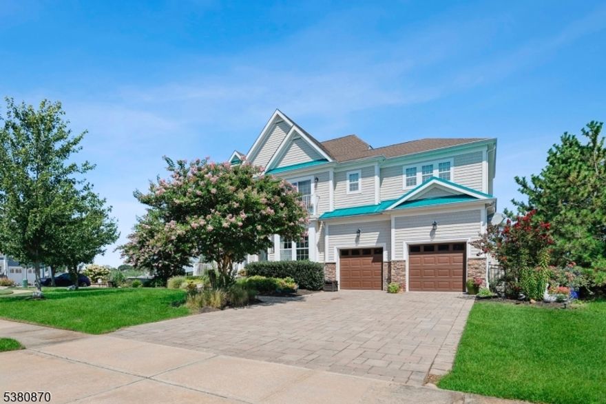 Stunning waterfront Colonial in The Sanctuary on Beaver Dam Creek. This 3,600+ sq ft home offers 4 bedrooms, 4 full baths, and a versatile third-floor bonus room with water views. Interior features include hardwood flooring throughout, vaulted ceilings, gas fireplace, custom moldings, and a well-kept gourmet kitchen with granite counters and stainless steel appliances. Spacious ensuite bedrooms and spa-like baths add to the appeal. Outdoors, enjoy a paver patio with firepit, a private 35'x17' boat slip, and added privacy with open association land next door. Complete with a 2-car garage and easy access to schools, shopping, and the Jersey Shore lifestyle.