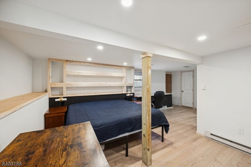 Charming 2-bed, 2-bath ranch in Hopatcong! Updated main kitchen with granite counters, stainless steel appliances, and hardwood floors (2018). Main bath also renovated in 2018. Sliders open to a covered porch and deck overlooking the fenced yard with above ground pool. Fully finished basement, with own entrance, includes a second full kitchen and additional full bath (added in 2025), ideal for an in-law suite, guest space or entertaining. Electric Water Heater (2025); roof is 5 years old. Great location close to major highways!