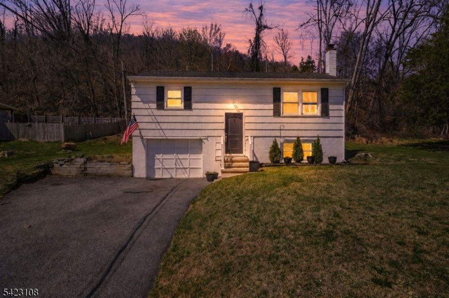 Welcome home to this fully renovated 3-bedroom bilevel located in the sought-after Vernon Valley Lake community of Glenwood. The bright, open living room flows seamlessly into an eat-in kitchen featuring a center island, breakfast bar, and sliders leading to a brand-new deck perfect for entertaining. The main level offers two bedrooms and a full bath, while the lower level includes a spacious third bedroom, family room, dedicated laundry area, and access to the attached garage. Recent upgrades include a newer septic system, roof, driveway, deck, front steps, appliances, updated electrical, and flooring throughout, French drain system, nothing left to do but move in. Enjoy lake privileges with access to swimming, boating, fishing, and ice skating. Set in a quiet, scenic location within walking distance to the Appalachian Trail, yet just a short drive to shopping, major highways, and Warwick, NY with its wineries, farms, and restaurants.