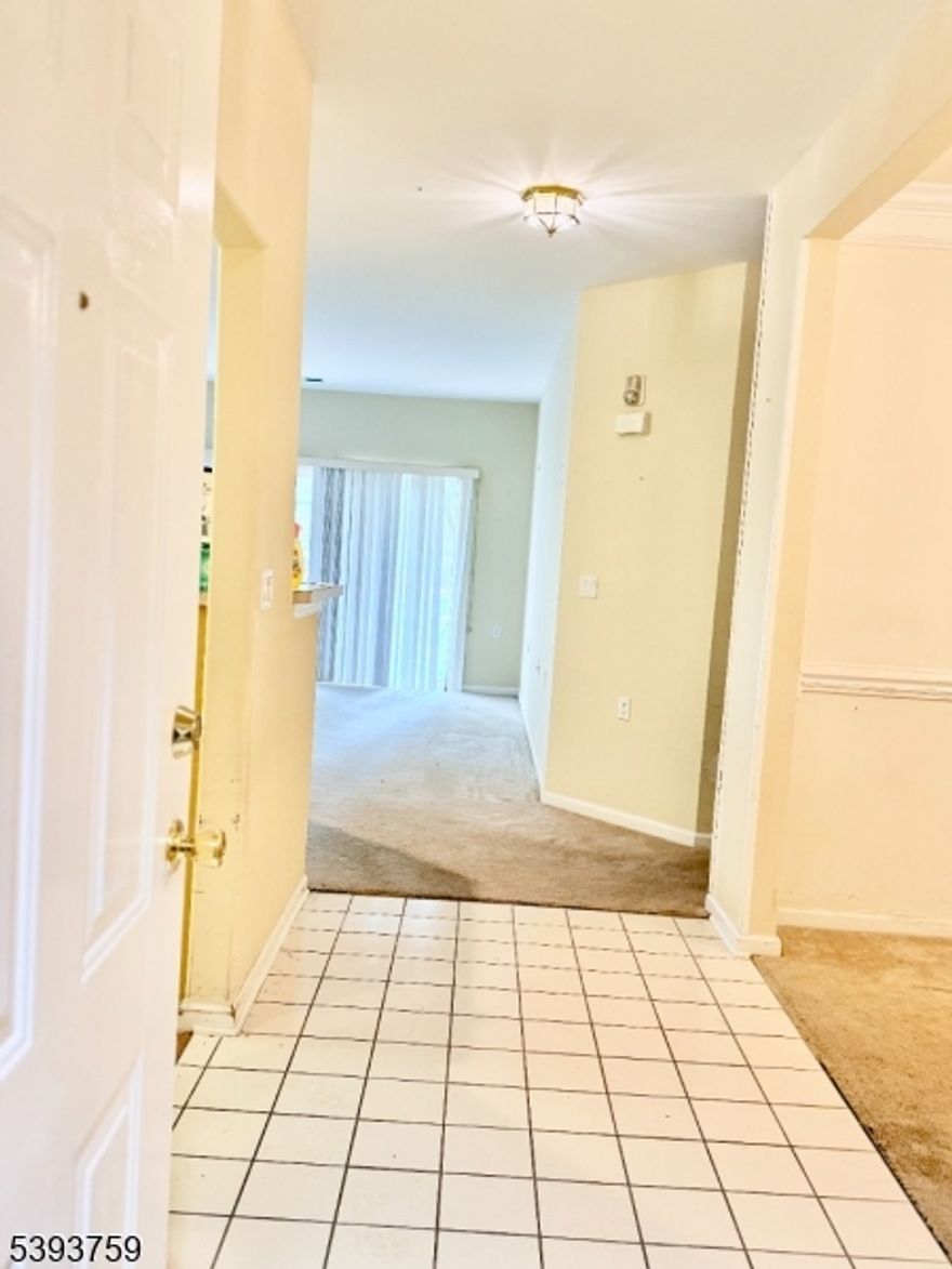 " Discover comfort, convenience, and a vibrant lifestyle in this light-filled active adult community home designed for easy living. The open-concept layout features spacious living/family room with sliding glass doors leading to a private wooded patio perfect for morning coffee or evening relaxation. The cheerful eat-in kitchen offers ample cabinetry and a spacious dining area ideal for casual meals or entertaining. A formal dining space provides extra flexibility for larger gatherings.The expansive primary suite offers wall-to-wall carpeting, closets, and a bath with vanity sink, soaking tub, and separate stall shower. The second bedroom and full guest bath are thoughtfully placed on the opposite side for added privacy. Throughout the home, a combination of carpet and tile flooring provides comfort and easy maintenance. A convenient in-unit laundry/utility room completes the well-designed layout.Enjoy direct interior access from your private garage to the building hallway and elevator. The community features a grand clubhouse, billiards, card rooms, fitness center, indoor/outdoor pools, hot tub, sauna, tennis and pickleball courts, and a cafe for relaxed dining.Prime location near major roads, NJ Transit, shopping, restaurants, parks, golf, and houses of worship. Quick closing available!