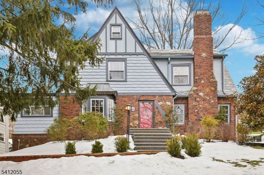 Located in the Upper Wyoming section of South Orange, with easy access to South Mountain Reservation and the neighborhood jitney to NYC trains, this home was renovated top to bottom in 2017. The exterior reflects classic Tudor architecture, while the interior offers the light-filled layout and practical flow of a Center Hall Colonial. This 4 bedroom, 3.5 bath home spans four finished levels of living space. The main level includes a well-appointed eat-in kitchen with plenty of room for a breakfast table and a center island, formal living room with fireplace, formal dining room,  powder room, den and sunroom. Upstairs, the primary suite provides a comfortable retreat, and the third floor functions well as a guest suite or private workspace. The finished lower level offers further options for recreation, fitness, or remote work. Central air ensures year-round comfort, and the attached garage adds everyday convenience. A spacious backyard with a stone patio provides outdoor space for relaxing or entertaining. A comprehensive renovation, flexible layout, and desirable location all come together beautifully at 9 Harding Dr.