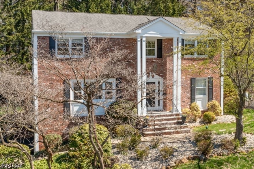 TURN-KEY is defined as a complete product ready for immediate use! From the moment you enter the spacious foyer, your eyes immediately scan the rooms as you decide whether to start your day by entering the living room/dining room, open-concept kitchen or family room. The stunning kitchen is nicely updated with custom maple cabinets, granite countertops and stainless steel appliances. The kitchen offers a custom desk area, seating at the counter peninsula, or a breakfast area to dine. The family room with wood burning fireplace is sun filled and bright and also has sliding glass doors out to the patio/yard. The first floor also has a powder room. Upstairs enjoy 4 large bedrooms all with hardwood floors a full bath (double vanity) and spacious landing. The primary suite offers a full bath and a separate office/flex space to meet your life needs! When you preview both bathrooms, take note of the custom glass partitions which both swing out providing easy access to the bathtubs. The lower level has a family room, laundry and inside garage entrance from the two car garage. On your visit, be prepared to sit outside on the large bluestone patio and take in the beauty this property offers. A private patio (natural gas line for grilling)/yard, the property extends well beyond the stone retaining wall and is adorned with mature landscaping! Grass yard fenced in! This home is convenient to schools, town/shops and businesses, YMCA and transportation to New York. Welcome home!