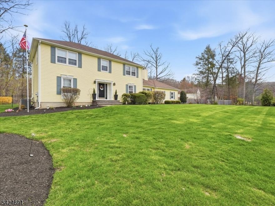 Spacious and beautifully maintained, this 4-bedroom, 2.5-bath Colonial sits on a private 1.02-acre lot in sought-after Mount Olive. A classic layout offers generous room sizes, including formal living and dining rooms, along with a warm and inviting family room featuring a wood-burning fireplace. The eat-in kitchen is designed for both everyday living and entertaining, complete with a breakfast bar, ample cabinetry, and a dedicated dining area.Upstairs, the primary suite offers a walk-in closet and private full bath, while three additional bedrooms provide plenty of flexibility for guests, a home office, or evolving lifestyle needs. Additional features include central air, multi-zone baseboard heating, a full unfinished basement with excellent expansion potential, and a 2-car garage.Step outside to enjoy a maintenance-free Trex deck with a natural gas grill hookup and a fully fenced rear yard perfect for relaxing or hosting gatherings. Recent updates include Lawn Doc contract paid through October, HVAC, Siding, Gutters, Front and Rear Doors, ADT system, and upgraded Garage Doors, offering peace of mind for years to come.