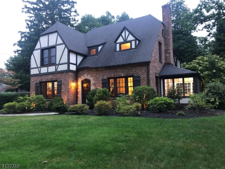 NEW LOOK!  NEW PRICE!  Wonderful 5 Bedrooms, 3.1 baths Center Hall Tudor.    The  2021 chef's eat -in kitchen with center island has a 6 burner Wolf range, Subzero refrigerator, Bosch dishwasher, Thermador convection wall oven, crisp white custom cabinets and marble counter tops.  A large renovated family room addition with gas fireplace, wet bar and custom built-ins is off of the kitchen.   Fabulous master suite with custom built-ins,  large walk-in closet and marble bath with a steam shower.  In addition, there is a 1st floor office, gas fireplace in the living room, au-pair suite,  wine cellar and high ceilings though out the house  Great flow from the kitchen and family room to the outdoor bluestone  patio and private professionally landscaped backyard on a level lot.  Close to Franklin School and NYC transportation. Meticulously maintained. Recent updates include 2022:  Central Air, New Garage Doors, Updated Powder Room, Freshly Painted Interior and Exterior.  Floors Refinished.  2021:  Hot Water Heater , Bluestone  Patio and  Walkways restored,  Upgraded exterior lighting and irrigation system.    The Chimneys and flues are sold in "as is" condition with no known issues.