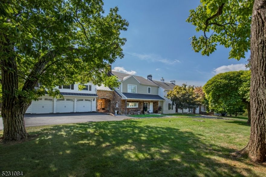 Seamlessly combining authentic historic charm and contemporary updates, a sophisticated Country Home dating back to 1780 was extensively renovated and expanded in 2011. Sited on 5.81 pastoral acres in Bernards Township, this cedar clapboard and fieldstone homestead was once part of a larger farm. While this home's early American heritage is displayed throughout, it also has a fresh, bright aesthetic which creates a welcoming impression, and is surrounded by extensive, mature grounds perfect for outdoor entertaining.The long drive entrance is marked by stone pillars and leads to an impressive all-stoned porte-cochere with brick herringbone flooring. The 15 room main house contains Five En- Suite Bedrooms with walk in closets, two Powder Rooms, Large Eat -in- Kitchen with custom cabinetry, Family Room, Dining Room, Living Room, Great Room, Private Main Floor Office, Exercise/Yoga Room,  Antique Tavern Room Circa 1700s, Gunite in-ground Pool with in ground Hot Tub, screened in Gazebo, double sided outdoor Fireplace, fully equipped Outdoor Kitchen with stone island and a semi detached 3 Car Garage. The property also boasts a two-story Carriage House with a separate entrance with it's own Kitchen, Large Bedroom, Family Room, Office, Bathroom/ Laundry Room, Storage Room, Private Yard, Driveway and Stone Patio. The home has a picturesque Pond with it's own private Cottage named "Anne's Cottage" with expansive wooden Porch.  Spectacular Sunsets!