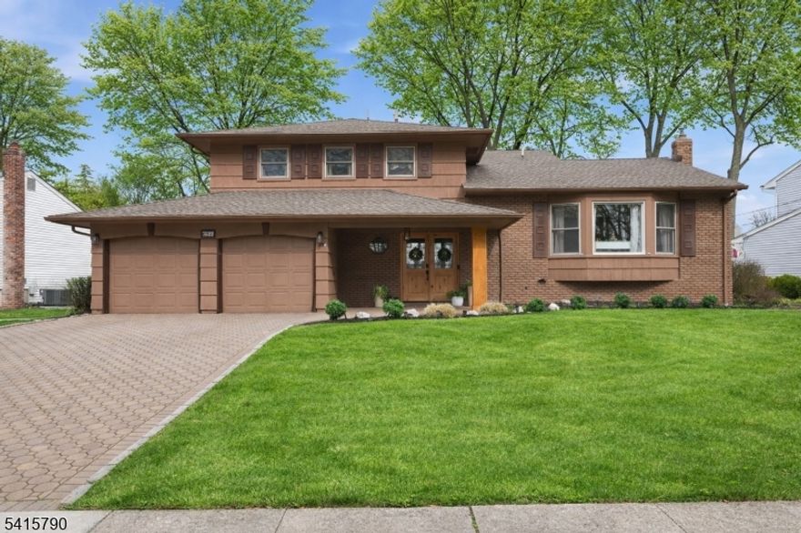 Welcome to this beautifully maintained split-level home offering 4 bedrooms, 2.1 baths, and a spacious 2-car garage, perfectly situated in a desirable neighborhood just across from Smithfield Park. This home combines comfort, functionality, and convenience, with easy access to major highways, NYC transportation, shopping, and a nearby playground. Step inside to find refinished hardwood floors and an inviting layout designed for both everyday living and entertaining. The formal dining room showcases high beamed ceilings, adding warmth and character, while the updated kitchen features ample cabinetry, granite counters, and a center island ideal for casual dining. The expansive family room offers direct access to the backyard, creating a seamless indoor-outdoor flow. Upstairs, the primary suite includes a walk-in closet and an updated private full bath, while three additional bedrooms provide plenty of space. The ground level features new laminate flooring, offering a versatile area for relaxation or recreation. Enjoy outdoor living in the fully fenced yard complete with a new 14' paver patio & underground sprinklers. The paver driveway accommodates up to four cars in addition to the 2-car garage. Additional highlights include central air conditioning, a 20kW Generac whole-house generator, newer floors & int. doors, interior paint, and a gas grill with permanent gas line perfect for year-round grilling. A fantastic opportunity to own a move-in ready home in a prime location!