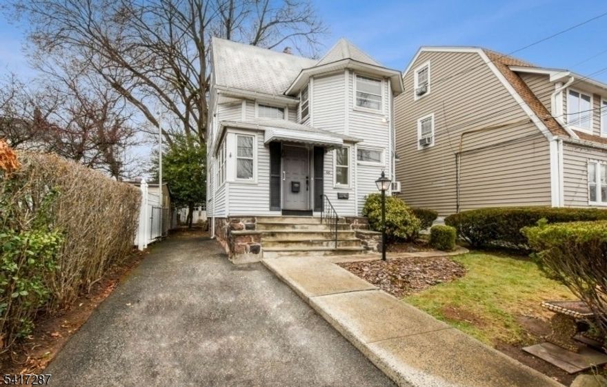 Welcome to this charming 4-bedroom, 1.5-bathroom colonial-style home, where classic elegance meets modern convenience in a beautiful neighborhood. As you step through the front door, you're welcomed into a spacious foyer that sets the tone for the open feel of the first floor. From there, a single wide French door leads into the inviting living room, which features a wood-burning fireplace, high ceilings, and original hardwood floors that flow throughout the home. The dining room adds a touch of elegance, highlighted by a stunning diamond-patterned leaded glass window, bringing in natural light and charm. Just around the corner, Halcyon Park offers a peaceful setting for a stroll or some fresh air. This home also features a lovely-sized backyard, perfect for outdoor gatherings, along with a garage that can be used for storage. Additional space is abundant with large closet space, a large attic, and a full-sized basement, offering plenty of room for storage or potential finishing options. The two-car driveway provides convenient off-street parking. Plus, on-street parking is also available for added convenience. Ideally located minutes from shopping, major highways, and parks, this home is also less than a mile from Watsessing Train Station, making commuting effortless. New York City is just a 30 to 45-minute drive away, offering easy access to work and entertainment. Don't miss this opportunity to make this exceptional home yours!