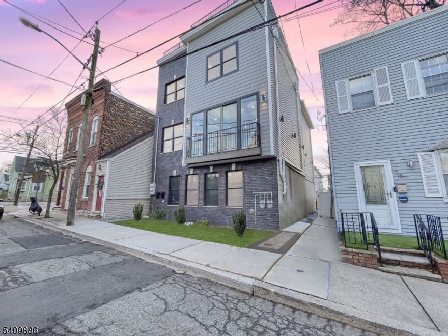 *MOTIVATED SELLER* PREPARED TO BE WOWED! This stunning, newly crafted 2-family home is a beautiful blend of modern convenience and elegant design. The crown jewel of this property is the rooftop deck with panoramic 360-degree views of the area. Features include high-end furnishings, flooring, and custom windows and doors. One unit offers a bright, airy layout with large windows. The main open-concept living area is on one level, featuring a spacious kitchen with top-of-the-line appliances, multiple sinks, and a convenient powder room. On the 2nd level, you'll find 5 generous bedrooms and 3 full baths. Two bedrooms include en suite baths, while the others share a hallway bath with a separate vanity. One bedroom features a private balcony with stunning views. Laundry is also on this floor. The other unit welcomes you with a bright and expansive living room that flows effortlessly into a formal dining area. Past the stairs, there's a kitchen with dual sinks and a charming breakfast nook. This level also has two bedrooms and a second half bath. Upstairs are 3 more bedrooms and 2 full baths, including one en suite with a balcony offering picturesque views. Convenient laundry is located on this floor as well. This home offers abundant storage, high-efficiency appliances, and a shared fenced backyard for outdoor enjoyment. Situated near bus lines, JFK Blvd, I-78, shops, parks, and restaurants, this property is perfect for owner-occupants or investors. Book your showing today!