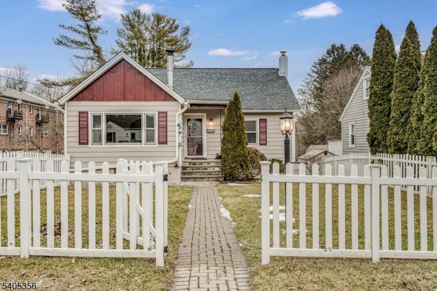 Equity opportunity and a perfect candidate for a 203(k) loan! This Cape-style home offers a straightforward value-add renovation, needing primarily a new kitchen (contractor quote already available) Recently refreshed with a newly painted exterior for strong curb appeal, plus a newer roof and chimney to protect your investment during renovation. A white vinyl picket fence and paver walkway create a welcoming first impression. Inside, enjoy hardwood floors throughout, charming wainscoting in the living and dining rooms, and a cozy brick surround with a wood-burning stove in the living room, a huge value amid rising utility costs. The kitchen has been fully gutted, offering a true blank canvas to design a dream kitchen and build immediate equity upon completion. The updated bathroom includes a tub/shower combination, with an additional renovation quote available for buyers looking to further customize. Additional features include a one-car built-in garage and a huge rear deck (recently painted) with stairs leading to a fully fenced backyard. The walkout lower level is partially finished with a den or home office, laundry area, abundant storage, and direct access to both the garage and backyard. Central A/C, a Roth oil tank, public water, and public sewer. Conveniently located near shops, dining, and Sussex County Community College plus Newton residents have FREE full day preschool and town pool membership.