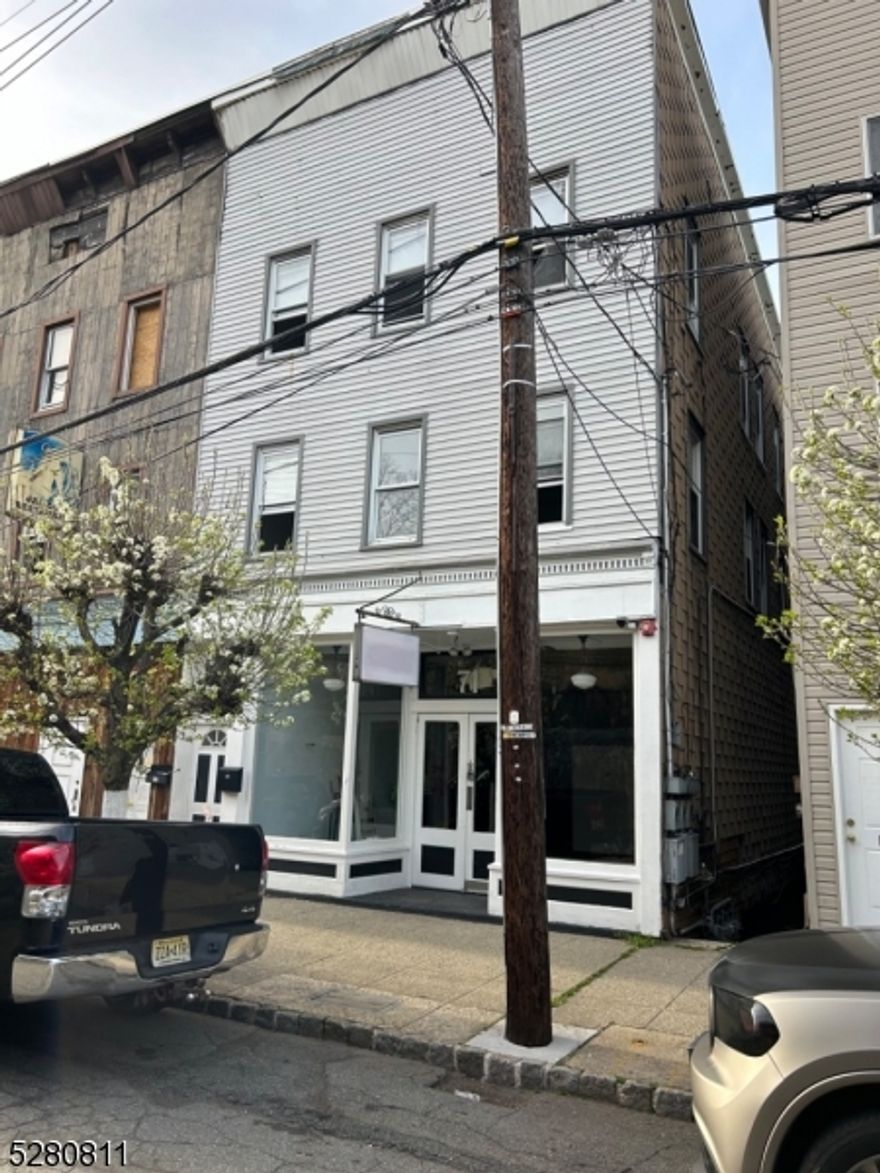 Opportunity to rebuild a great mixed use location in Dover.  Store front, with 2 large row style 3 bedroom apartments.