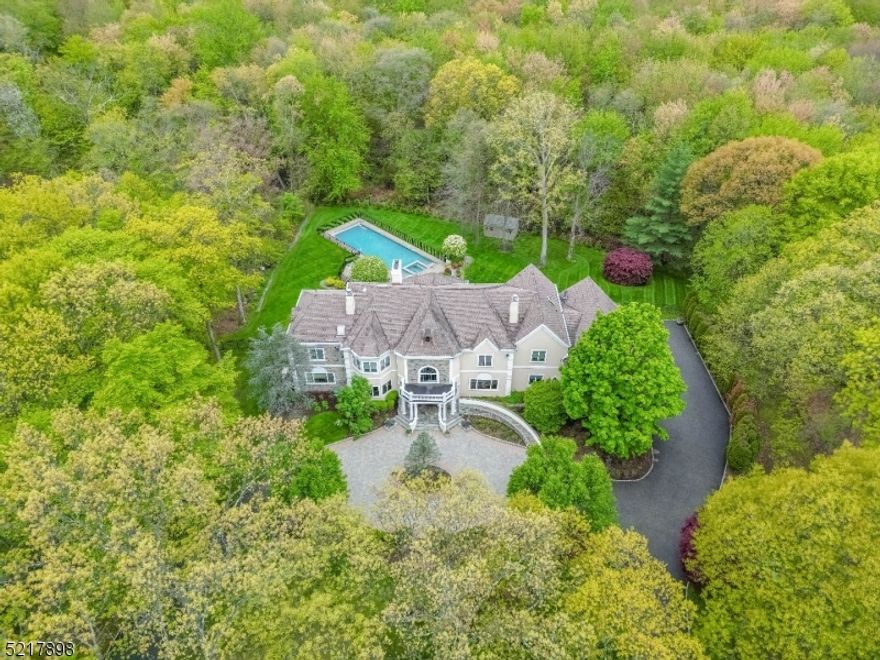 THIS INCREDIBLE  MANOR OFFERS EXQUISITE DETAILING & CLASSIC ELEGANCE .BEAUTIFULLY APPOINTED THIS COLONIAL SITS ON 2 PRIVATE ACRES & FEATURES CIRCULAR DRVWY & GRAND ENTRANCE. GLEAMING 2 STY EF & BRIDAL STAIRCASE. LR W/DUAL FPL. BANQUET SIZE FDR,FORMAL LIVING ROOM, SOARING 2 ST. GREAT RM  W/FPL & VIEWS OF REAR OASIS.FAMILY RM W/BUILT-INS. GOURMET KITCHEN WITH STATE-OF-THE-ART NEW APPL.SUN FILLED  BREAKFAST RM SURROUNDED BY WINDOWS OVERLOOKING THE PRIVATE GROUNDS.HOME OFFICE/DEN, BR EN-SUITE, PR, LAUNDRY RM & ACCESS TO 4 CAR GARAGE COMPLETE THE 1ST FL. 2ND FL INCLUDES ELEGANT OWNERS SUITE W/HUGE WALK-IN CLOSET, LUXE BATH W/JACUZZI, LG SS & SAUNA. LIBRARY W/ IMPRESSIVE BUILT-INS & FPL. 4 BRS EN-SUITES & UNFINISHED BONUS RM. ENORMOUS LWR LVL W/BILLIARD RM, WET BAR, HOME THEATER, GYM, BATH, PLAY AREA & HUGE STRG RM.WHOLE HOUSE  GENERATOR, GUNITE POOL& SPA  ENCOMPASSED BY BLUESTONE STONE PATIO, PERGOLA, BUILT IN BBQ.