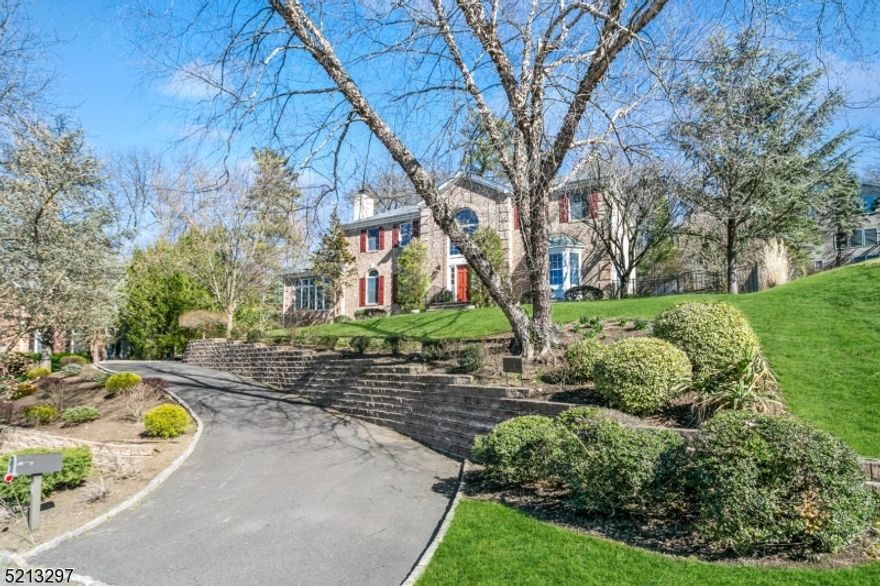 Prestigious home nestled atop professionally landscaped grounds in a desirable cul-de-sac location! Sophisticated open floor plan boasts spacious, sun-filled rooms w/designer finishing touches, sprawling hardwood floors, oversized windows. 2-story foyer w/sweeping curved stairs. Living room w/modern fireplace & tall arched windows. Conservatory w/walls of floor-to-ceiling windows. Office w/double French doors. Dining room w/tray ceiling, dazzling chandelier, & bay window. Open-concept family room & kitchen w/abundant natural light, & serene views. Family room w/handsome fireplace & wall of floor-to-ceiling windows. Gourmet kitchen with accented cabinetry, high-end appls, granite counters, & large size center island. Designer powder room. Spacious Master bedroom w/sitting room & well-appointed ensuite bath. 2 bedrooms share Jack-&-Jill bath; 4th bedroom w/ensuite bath. Beautiful finished basement w/5th bedroom & full bath. Close proximity to NY trains, award winning Chatham schools, shopping, restaurants and major highways!