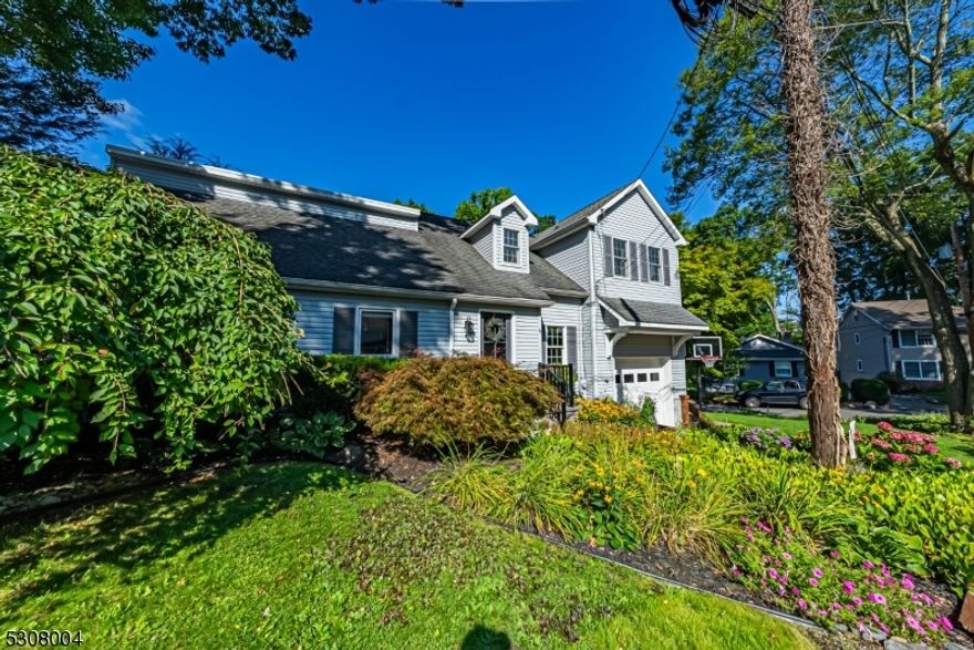 True Pride of ownership in this custom and charming home! Beautiful hardwood flooring. Lovely Architectural Features throughout, gives this Home a Lake Cottage Feel! Stunning kitchen with breakfast bar, pantry and stainless steel appliances. Open dining area and a bright, large living room with multiple windows and tons of natural light. Laundry/mudroom with sloop sink and indoor garage access. Convenient first floor bedroom and full bath. Upstairs, a primary bedroom offers an en-suite bath. 2nd bedroom and an office. Generous loft space. This floor can be accessed by either a spiral or traditional staircase. Neutral colors throughout. Super-sized garage has high ceilings. Corner property, beautifully landscaped front & private back area with wood fence and deck. Tremendous curb appeal! Full house natural gas generator, dual AC & furnace. Downstairs ac condensor brand new. Enjoy all that Indian Lake has to offer. Fantastic location; walking distance to Indian Lake Bistro, ILCC Clubhouse, beaches, swimming, boating, playground & fun! Mins from DWTN Denville, NYC commuter locations for both bus & trains. Top Schools! House has been meticulously maintained.