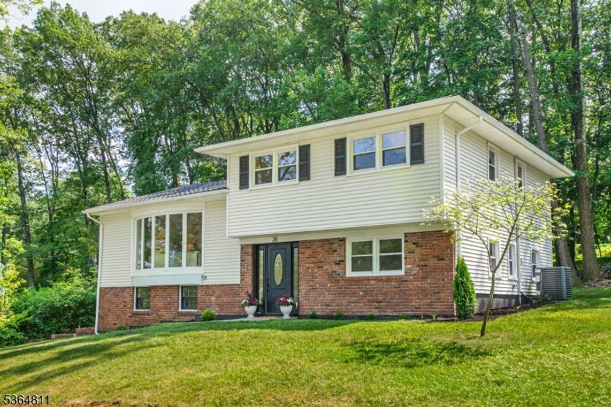 Stunning, completely renovated split-level home in the heart of Morris Plains, only 1 mile to NYC TRAINS. Meticulously updated from top to bottom, this home combines modern luxury with timeless style. Every inch has been thoughtfully designed with high-end finishes and exceptional attention to detail, creating a truly move-in-ready home. Step inside to discover a bright and open floor plan featuring gleaming hardwood floors, an open layout kitchen featuring modern two-toned cabinetry, premium SS appliances, & sleek quartz countertops, adjoined by a spacious living & dining areas offer the perfect setting for both relaxing and entertaining. Upstairs, you'll find 3 bedrooms and a spa-like bathroom. The ground level offers a Family room with access to the patio, a 4th bedroom & full bath that can be a guest suite. Basement level offers a large laundry/storage room. Off the kitchen is an expansive covered back porch, a true highlight of the home. This exceptional outdoor living space is perfect for relaxing or entertaining in any weather, offering comfort and style all year round. Located just minutes from top-rated schools, parks, shopping, dining, and direct train service to NYC, this exceptional home offers the best of suburban living with unbeatable convenience.Don't miss this rare opportunity to own a turn-key home in one of Morris Plains' most sought-after neighborhoods!  Updates include: NEW ROOF, AC, 2-Zone Boiler, WH, and so much more! See the complete list of Upgrades!