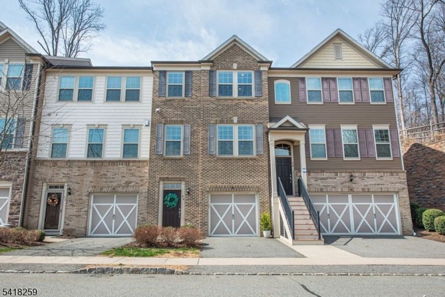 Welcome to this beautiful townhome that offers 2 bedrooms, 2 full baths, and 2 half baths across three spacious levels. The main floor features high ceilings and a stunning kitchen with granite countertops, stainless steel appliances, a pantry, breakfast area, and sliding glass doors leading to a private back deck-perfect for relaxation. The adjoining dining and living areas provide abundant natural light, 9-foot ceilings, elegant flooring, and large windows that create an inviting atmosphere. Upstairs, the primary suite impresses with an oversized walk-in closet and a private ensuite bath featuring a double sink vanity. The second bedroom also offers a private full bath. The ground level includes another living space perfect for an office, recreation room or flex room, powder room, laundry area, and direct access to the attached one-car garage. Enjoy community amenities including beautifully landscaped grounds, an outdoor pool, clubhouse with meeting room, kitchen, and gym, plus scenic hiking and biking paths. Conveniently located near shopping, parks, the Randolph Trails, restaurants and more!