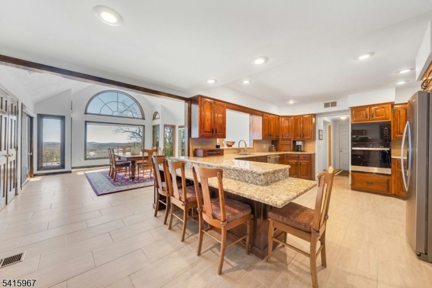 Beautiful home set on a large, gorgeous property with stunning mountain views offered for sale by original owners.  The home is part of the private Green Pond Lake community and offers all the amenities associated with mandatory lake membership including swimming, boating, sailing, fishing, tennis, paddle ball and much more.  The home itself has a versatile floor plan which you can acclimate to your needs.  Rooms are large and the home is meticulously maintained.  There are 6 bedrooms and 4.5 bathrooms.  In addition to the massive great room addition with a fireplace there is a separate, cozy family room with a fireplace.  The kitchen is large and has a wonderful breakfast room with an idyllic view of the mountains and a distant view of NYC.  The home is located on a private road with neighbors sharing the plowing costs.  Green Pond membership is mandatory with a sliding initiation fee based on sale price and yearly dues of $2750.  Come see this beautiful property today...you will not be disappointed!