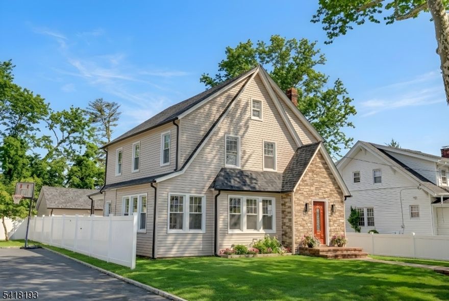 This beautifully remodeled 4-bedroom, 2.5-bath home features a private rear yard, garage, and a covered patio with Trex decking perfect for relaxing or entertaining. Step inside through the foyer, which opens into an expansive living room with a cozy fireplace, creating a warm and inviting atmosphere. The first floor includes a formal dining room, a versatile bedroom or home office, a full bath, and a stunning brand-new kitchen with a built-in laundry area. From the dining room, French-style sliding doors lead directly to the patio, backyard, garage, and off-street parking. Upstairs, you'll find three generously sized bedrooms and a fully updated main bathroom with a tub. The finished basement offers two large recreational spaces along with a new half bath ideal for additional living, work, or play areas. Major upgrades include all-new plumbing and electrical systems, a 2-zone HVAC system with central air, luxury vinyl flooring, new windows, siding, gutters, roof, driveway, and walkway pavers. Move right in and enjoy peace of mind in this thoughtfully renovated home that perfectly blends classic style with modern convenience.