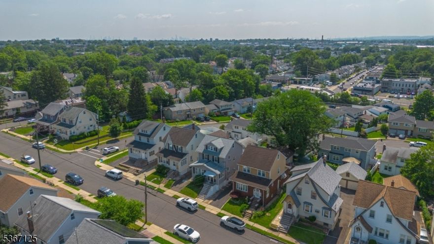 Step into this beautifully renovated Colonial, where charm meets modern convenience. An inviting foyer welcomes you with an abundance of natural light, leading into a spacious living room featuring gleaming hardwood floors. The main level also offers a versatile den perfect for a home office, playroom, or guest space, a formal dining room ideal for entertaining, and a stunning renovated kitchen complete with quartz countertops, top-of-the-line appliances, and smart Bluetooth-connected features. The second floor boasts three generously sized bedrooms, all with hardwood floors and ceiling fans equipped with lights and built-in speakers, along with a fully renovated bathroom featuring a luxurious jetted tub. The third floor offers an additional spacious bedroom perfect as a guest suite or private retreat. The fully finished basement is a showstopper, featuring a stylish wet bar, cozy family room, full bath, and a dedicated laundry area. Step outside to a brand-new deck, perfect for enjoying summer days, and a fenced-in yard (new fence installed in 2019) for added privacy and outdoor fun. Additional highlights include a two-car detached garage, long driveway with ample parking, water heater (2020), and a new roof and chimney (2022). This move-in ready gem combines modern upgrades with timeless appeal don't miss it!
