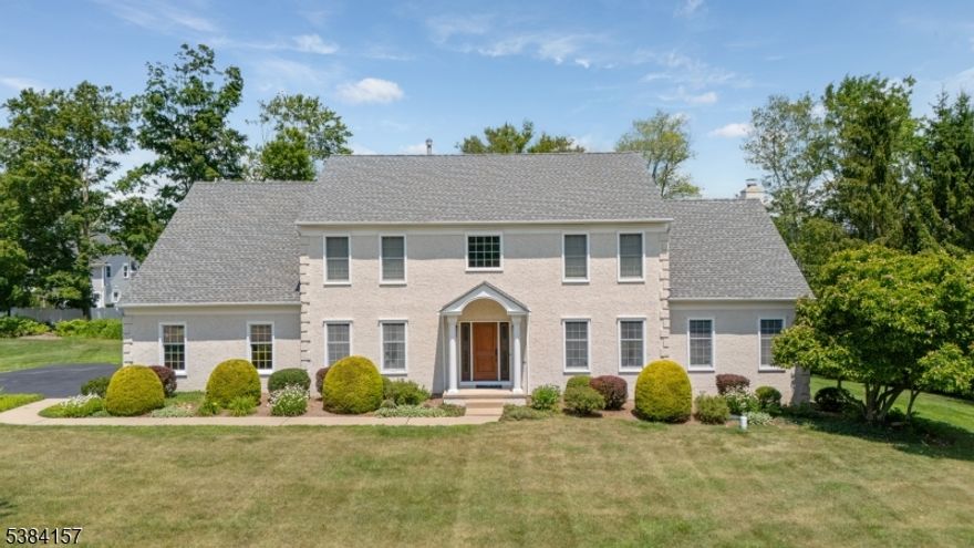 Welcome to 10 Robin Drive, a stately Colonial on a flat corner lot in one of Denville's most popular neighborhoods! The grand double-height foyer, with its curved staircase and catwalk, sets the stage for a home filled with natural light and thoughtful design. The floor plan offers wonderful flow for both everyday living and entertaining. The family room features a cathedral ceiling, wood-burning fireplace and stylish arched windows, while the formal dining room, den, and eat-in kitchen with sliders to the yard create seamless gathering spaces.Upstairs, you'll find four generously sized bedrooms, including a huge primary suite with walk-in closet and spa-like en suite bath featuring 2 individual vanity areas to make getting ready a breeze, a soaking tub, separate glass-enclosed shower, and skylight. Additional highlights include:  large windows throughout, main floor powder room, molding details, office, laundry room, rear paver patio, and a 3-car garage. This home combines classic elegance with modern updates in a light-filled, functional layout.