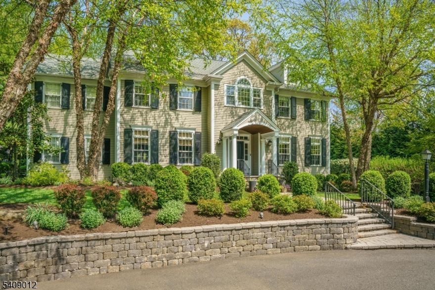 Live life where every day feels like a vacation getaway. Set on nearly one flat acre in the heart of Short Hills, this resort-style property blends effortless luxury with relaxed indoor-outdoor living. Lounge beside the in-ground pool with its tranquil water feature, shoot hoops on the sports court, or host summer dinners under the stars. The backyard is completely private, beautifully landscaped and designed to elevate daily life. Inside, six bedrooms, five full and two half baths, and four finished levels offer generous spaces to live, work and entertain with ease. Flowing into open living and dining areas filled with natural light, the crisp white kitchen is both stylish and functional with an octogonal breakfast room flanked with walls of windows. The second level features 5 bedrooms and an envious primary suite while an expansive finished third level adds flexibility. The lower level is a destination of its own, boasting a private gym, full bath, oversized recreation and media spaces, and a dedicated office wing with its own entrance, perfect for working from home or meeting clients in a professional setting. This home was designed for the way we live now, with thoughtful upgrades, timeless finishes and space to grow. Whether you are hosting a crowd or enjoying a quiet night in, every detail reflects quality and comfort. Located just minutes from top-rated schools, downtown Short Hills and Midtown Direct trains, this is not just a home but rather a lifestyle all its own.