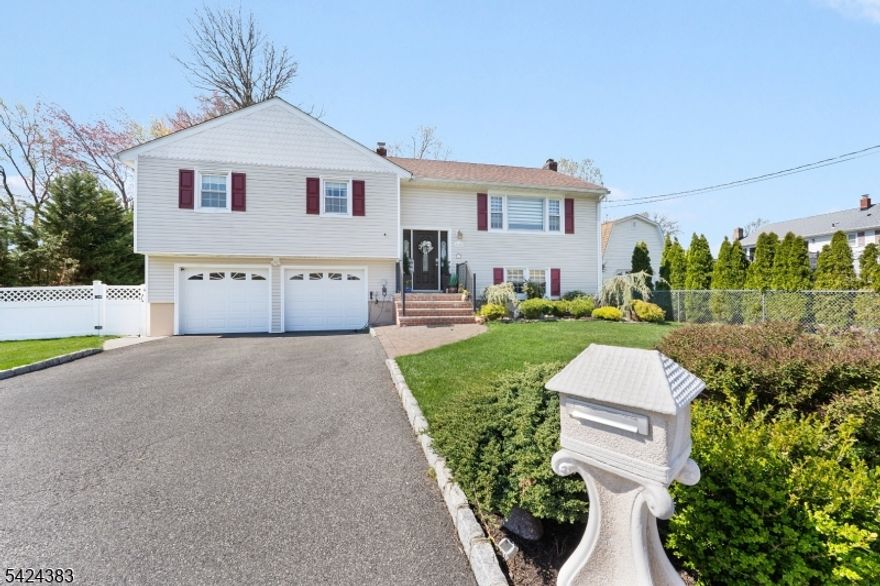 Beautifully updated home in a desirable neighborhood offering style, comfort, and modern amenities throughout. Step into the two-story foyer and proceed upstairs to a spacious living room featuring a large window that fills the space with natural sunlight. The living room opens seamlessly to the dining room, creating the perfect setting for everyday living and entertaining.The open-concept kitchen has been newly remodeled and features soft-close cabinetry, glass-front cabinets, breakfast bar, stainless steel appliances, wine refrigerator, stainless steel exhaust hood, glass tile backsplash, and high ceilings enhanced by a skylight, pendant lighting, and recessed lighting. Three bedrooms are located on this level, each offering hardwood floors and spacious closets. The beautifully designed main bathroom includes a freestanding soaking tub, custom tiled shower with bench and niche, and a sleek floating vanity.The ground level offers a generously sized family room with fireplace and ceiling beams, an additional bedroom, full bath, and separate outside entrance ideal for extended living or guest space. A two-car garage with EV charger adds convenience. Enjoy the entertaining backyard featuring a covered paver patio and firepit perfect for relaxing or hosting gatherings, along with a pool. Solar panels provide added energy efficiency. Roof 6 years old; CAC and furnace 5 years old, offering added peace of mind. This home is close to Esposito Park and Kumpf Middle School.