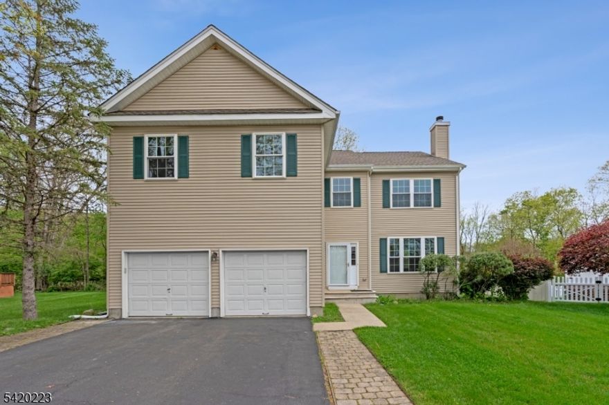 Perched high at the end of a quiet cul-de-sac, this stunning 2018 Colonial in desirable Brook Hollow Estates offers the perfect blend of elegance, comfort, and modern living. A welcoming foyer opens to formal living and dining rooms adorned with rich hardwood floors, setting the tone for the home's sophisticated style. The custom kitchen is a true centerpiece, featuring granite countertops, a center island, wine refrigerator, five-burner range, stylish backsplash, and stainless steel appliances. A separate dining area provides easy access to the private backyard ideal for everyday living and entertaining alike. The open floor plan flows seamlessly into the impressive two-story family room, filled with natural light and designed for gathering. A powder room, laundry room, and direct access to the two-car garage complete the main level. Upstairs, the spacious primary suite is a retreat of its own, entered through double doors and offering hardwood floors, a sitting area, a walk-in closet plus an additional closet. The luxurious en-suite bath includes a soaking tub, double sink vanity, and a glass-enclosed shower. Three additional generously sized bedrooms and a full bath complete the second level. The finished basement expands your living space with a recreation room, full bath, and ample storage. This exceptional home is a hidden gem don't miss the opportunity to make it yours!