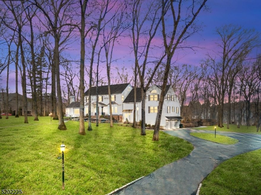 This stunning home, situated on a private cul-de-sac, boasts over 6000 square feet of luxurious living space. Recently renovated to perfection, it offers spacious rooms, custom woodwork, high ceilings, and hardwood floors. On the first floor, you will find a formal dining room, living room, family room, each with a fireplace, and a gourmet kitchen with a center island, stainless steel appliances, granite countertops, and breakfast area. The first floor also includes a bedroom suite, office, laundry room, and two powder rooms. The second level houses the grand master suite with dual walk-in closets and a luxurious bath with a jetted tub, shower, and dual vanities. Two additional en-suite bedrooms and a bonus room with a powder room complete the upper level. Outside, you will enjoy the 1.7 lush acres of grounds, with a heated in-ground pool, a pool house with a kitchen, fireplace, and sauna, a patio, and a 3-car attached garage. This magnificent home truly has it all! Please take note Assessed Valued were appealed in 2011. Property taxes are low for this size home and land size.