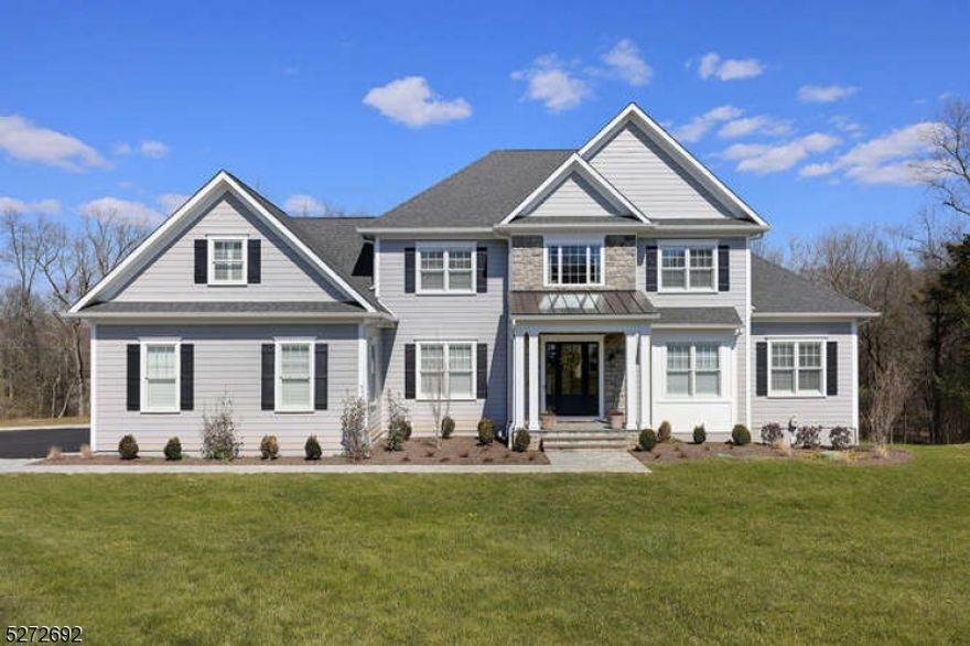 Amazing opportunity! Gorgeous luxury, 4 months young new construction Colonial on cul de sac! Blue stone paver exterior walkway and front porch welcome your guests. Red oak hardwood flooring throughout 1st & 2nd fls, coffered ceiling in LR, raised panel solid core interior doors, window seats with custom cushions, custom plantation shutters & roman shades, wainscoting, trey & vaulted ceilings, French doors, all custom closet shelving, designer mirrors & Kohler fixtures, full house generator, tankless hot water heater, 10 ft ceiling height on 1st fl, 9ft 2nd floor & lower level. Desirable 1st floor guest ensuite! 1st fl open concept with loads of natural light offer flexible dining and entertainment options. Gourmet luxury chef's kitchen will surely be a gathering place for all. Top of the line Thermador appliances, quartzite countertops, oversized island w/ prep sink, garbage disposal, & butcher block extension, 36" farmhouse sink w/filtered water and walk-in custom pantry & large mudroom! Warm & inviting FR w/ gas FPL & access to composite deck & bbq natural gas line. 2nd fl primary ensuite features sitting rm & spa bath retreat w soaking tub, oversized shower & his/hers walk in closets. 2 add'l BRs share Jack n Jill bath & large beautiful 2nd floor laundry. Walk out lower level boasts a home theatre carpeted w/ raised platform for seating & wired for for an amazing sound and viewing experience, rec room, full bath, gym/5th BR. 2 car oversized garage w/ Tesla charger.