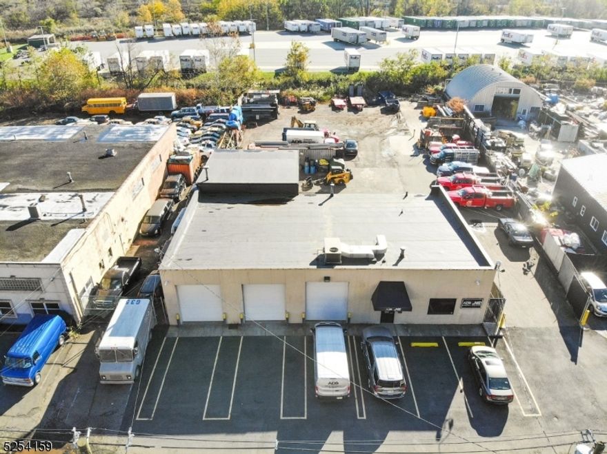 4200 sq.ft. 1 story building on over half acre in Porete Redevelopment Zone. Currently construction yard & light manufacturing. Well maintained building has 5-12'garage bays, 3 front bay doors w/13' to 11' ceilings, 2 rear bays w/16'ceiling. 4 half baths, 1 in each workshop. Modern, quality office approx. 1400 sq.ft. with reception, 2 private offices, kitchenette, 2 half baths & open area. Office heated Gas Forced air heating/central air unit approx.7 yrs old. 240 volt 3 phase power. Garage/Warehouse/work area heated by gas blowers,includes racks, crib & shelving. EPDM roof (durable synthetic rubber membrane) installed 2019. Rear yard can accommodate machinery, trucks, material and includes a Convault 2,000 gallon above ground tank, 1-40' storage and 2-20' containers, material bins, 2 story racking. No known environmental issues.Lot size 100'x225'x124'x237'.Site is a short distance to major highways ie:NJ TPKE, Route 280/80, Garden State Parkway, 8 miles to NYC via Holland Tunnel.