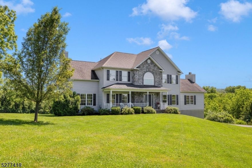 Upon arriving at this home nestled in a quiet neighborhood, you'll first notice the porch perfect for enjoying spectacular sunsets. Enter through the grand 2-story foyer and notice how every room is bathed in bright natural light. The formal living and dining rooms are perfect for entertaining. French doors unveil the formal living room, charming conservatory with a wood burning fireplace, and versatile bonus room with full bath, ideal for an in-law suite.The newly renovated spacious kitchen boasts a center island, granite countertops and ivory cabinets, complemented by an inviting breakfast area with sliders that lead to the recently renovated deck and views of the park-like backyard. The breakfast area adjoins an expansive great room featuring a cathedral ceiling and a wood burning fireplace. The main level is further enhanced by a convenient laundry room. Retreat to the primary suite on the upper level, complete with walk-in closet, en-suite bath featuring a stall shower and luxurious soaking tub. Three additional bedrooms with ample closet space complete the second floor. The large unfinished basement offers endless possibilities for customization. Sliders open from the basement onto a lovely paver patio offering a great private space for entertaining or relaxing. A 2-car garage with Level 2 electric car charger adds practicality to this luxurious abode. With multi-zoned heating and central air conditioning, this home offers comfort and style in a rare idyllic setting.