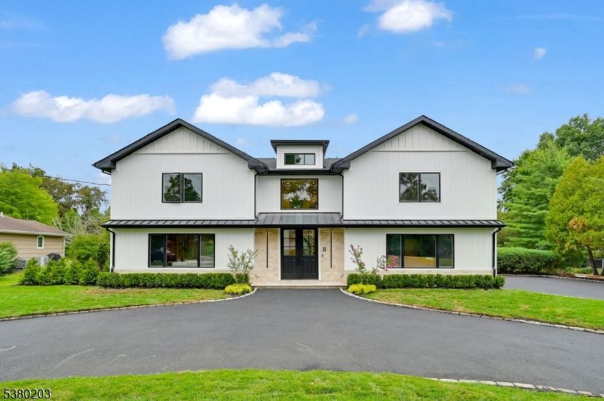 A Stunning Modern Oasis on a Rare 0.59-Acre Flat Lot with a Circular Driveway !!! Welcome home to this fully renovated 5-bedroom, 4.5-bath, 3,736 sq. ft. home that perfectly blends modern luxury with serene, expansive living. Step into a dramatic 2-story foyer that sets the tone for the open, light-filled layout. At its heart is a gourmet chef's kitchen, a true showpiece with Wolf & Thermador appliances, sleek design, and premium finishes. The main level features high-end engineered floors throughout, a formal dining room, elegant living room with electric fireplace, spacious family room, mudroom, and powder room. Upstairs, the luxurious primary suite offers two walk-in closets and a spa-like bath with dual vanities, soaking tub, and stall shower. A junior ensuite, two additional bedrooms with a shared hall bath, and a convenient laundry room complete this level. The finished basement is an entertainer's dream, boasting a spacious rec room, custom wet bar with beverage cooler, a bedroom, and a full bath. Exterior highlights include premium Hardie Artisan siding, an EV-ready 2-car garage, beautifully landscaped backyard, and a large deck ideal for entertaining. Modern comforts include 2 HVAC systems with 3-zone control and a full Ring security system. Set in a top-rated school district with proximity to direct trains to NYC, major highways, & premier shopping, this rare property offers sophistication, space, & an exceptional lifestyle opportunity in Livingston- A Must See !!