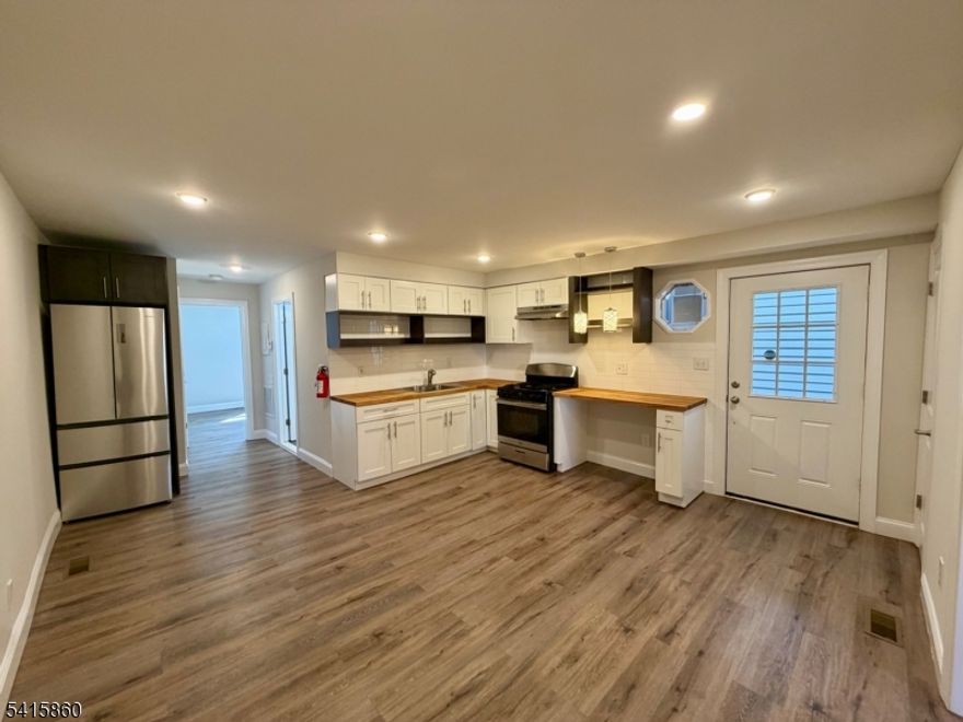 Downtown Montclair is calling your name! This renovated 2-bedroom apartment creates the perfect space for relaxation and living with a large backyard and is a commuters dream. Enter the apartment into a spacious open layout. The kitchen has new stainless steel appliances that flows nicely to the living room/dining room combo. There is one bedroom on each side of the apartment separated by the main living space, creating the perfect amount of privacy. There is also a very clean 210sf private basement with a washer and dryer with plenty of room for storage. You'll love being steps from Bay Street Train Station, restaurants & shops of Downtown Montclair, plus The Welmont Theatre, Montclair Art Museum, Montclair Film and more!