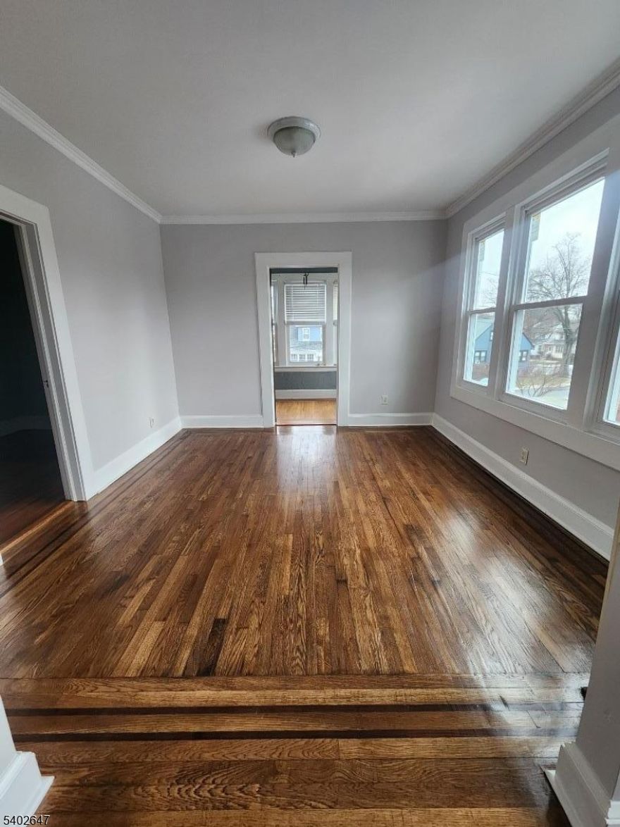 Move right into this beautifully updated, spacious three bedroom apartment with finished attic! This second floor apartment has beautiful wood floors throughout. Eat in kitchen with stainless steel appliances. Relax in the sunroom and enjoy tons of natural lights or take a step on the outside private porch. Small third bedroom can also be used as an office. Finished attic with shelves and new carpet installed. This spacious apartment also has new windows. Shared laundry in the basement as well as storage. Pet friendly for an additional monthly fee and on street parking.