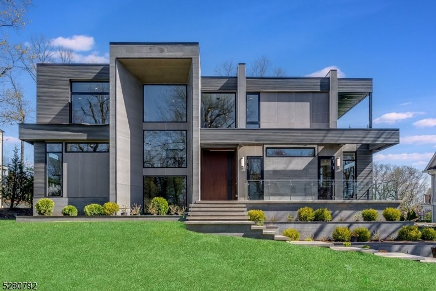 This new construction custom contemporary home is a masterpiece by local AHM architects.Set on nearly half an acre on the prestigious Hartshorn Dr.7800 sf of vast open floor plan & lofty ceilings creating multiple entertaining spaces.You're greeted by a soaring pivot front door opening into a 2 story foyer w/ chevron detail & floating staircase w/ custom glass railing.This home offers multiple outdoor spaces, an elevator to all three floors, wide plank white oak floors, multiple office options, walls of oversized German style modern windows, custom closets, convenient 2nd floor laundry room, private in-law suite w/ en suite bath, 10' ceilings & a show stopping kitchen w/ Wolf, Sub-Zero, Dacor & Miele appliances & sleek Dekton countertops.A hidden prep kitchen offers a entire second set of appliances.All bedrooms are generously sized w/ ensuites including the primary suite oasis w/ 2 custom walk-in closets, spa-like primary bath w/ radiant heated floors & private office/sitting room.Relax on a large deck w/ built-in outdoor kitchen & outdoor full bathroom with views of the level backyard w/ plenty of room for a pool.Lower walk-out level has maid's quarters w/ full bath, expansive rec room, wine room, theater & mudroom w/ access to 2.5-car garage w/ 2 EV chargers.This home is equipped w/ Automated Vantage Lighting System.House is pre-wired for speakers, shades, TV and audio for future home automation.300 amp electrical service.Close to highly rated Hartshorn School.